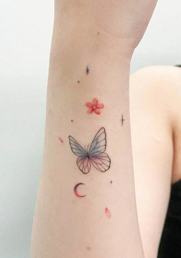 Tattoos for the Back of the Arm with Watercolor or Minimalist Designs on the Back of the Arm: Small, colorful butterfly and flower ink.