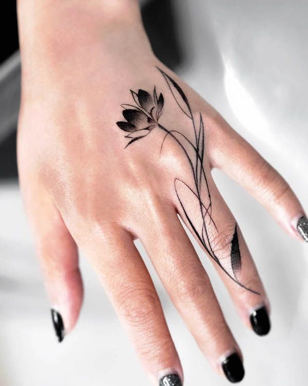 Elegant floral tattoo on hand
