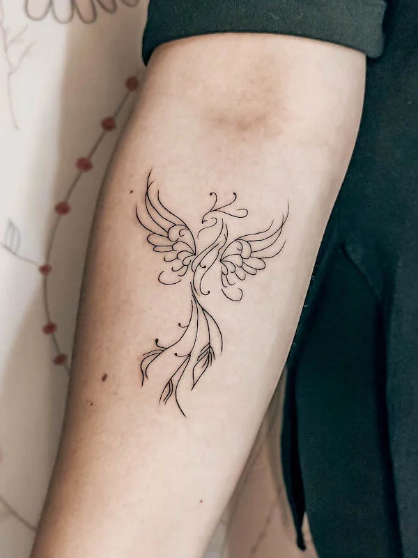 Cute arm tattoo women: Fine line abstract phoenix forearm tattoo for new beginnings and transformation.