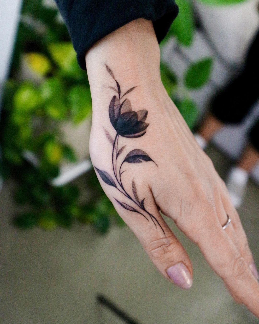 Elegant floral tattoo on hand